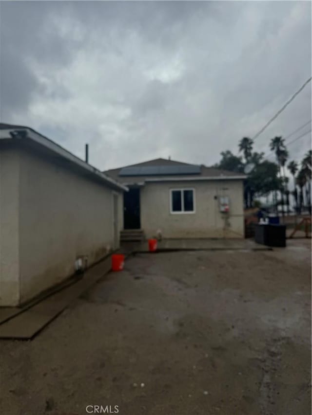 rear view of house featuring a patio area