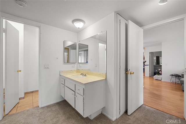 23515 Lyons Ave Unit 210, Valencia, CA 91355 - bathroom with vanity and carpet floors