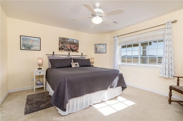 bedroom with light colored carpet and ceiling fan