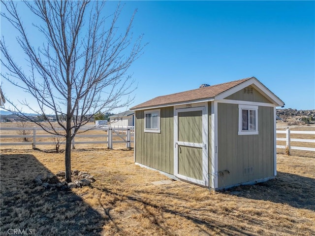 view of outbuilding featuring a rural view