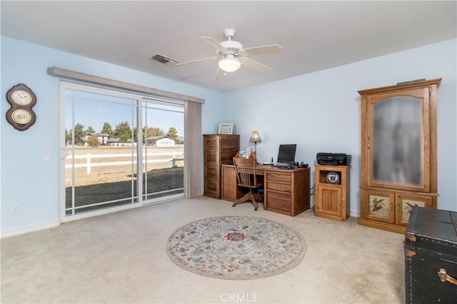 office area with light colored carpet and ceiling fan