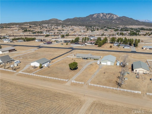 birds eye view of property featuring a mountain view