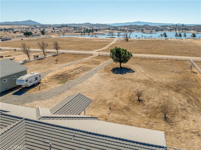 aerial view featuring a water and mountain view