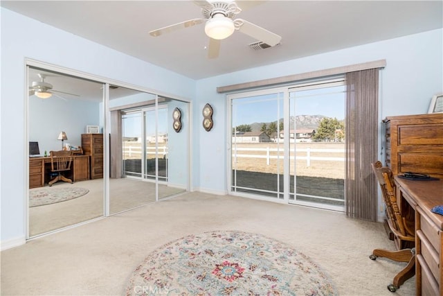 bedroom with ceiling fan, carpet floors, a closet, and access to outside