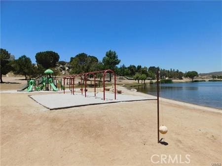 view of jungle gym featuring a water view