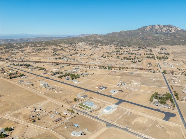 birds eye view of property with a mountain view