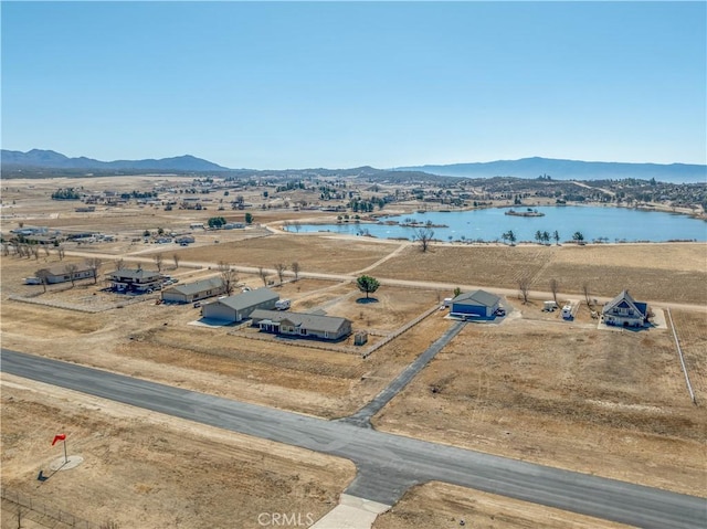 bird's eye view with a water and mountain view and a rural view