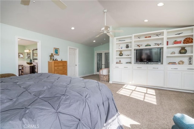 carpeted bedroom with ceiling fan and lofted ceiling