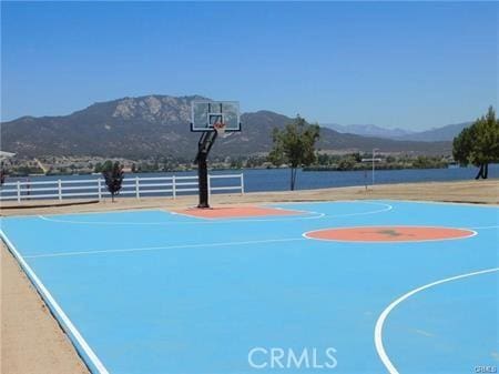 view of basketball court featuring a mountain view