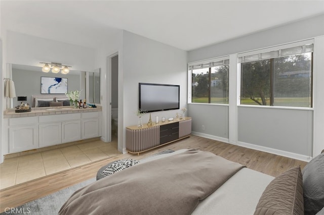 bedroom with light hardwood / wood-style flooring