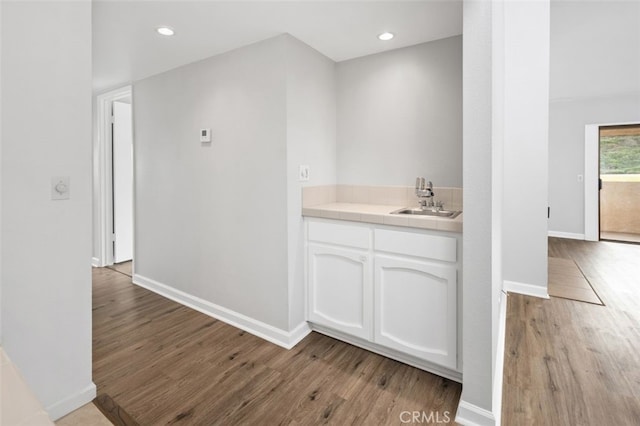 bathroom with sink and hardwood / wood-style floors