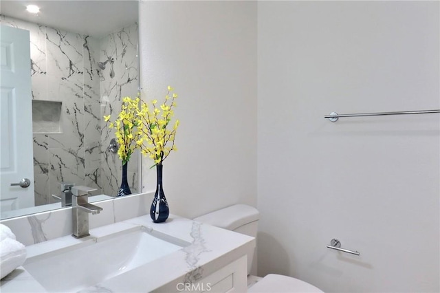 bathroom with vanity and toilet