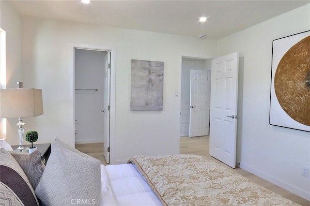 bedroom with light wood-type flooring