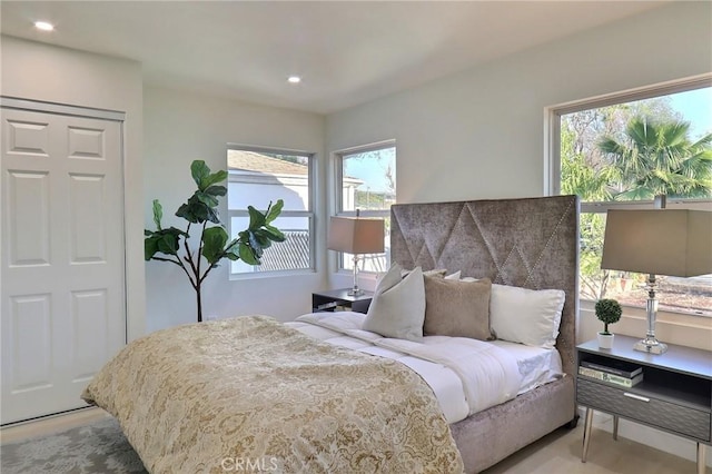 bedroom featuring multiple windows