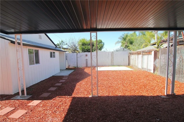 view of yard with a fenced backyard and a patio area