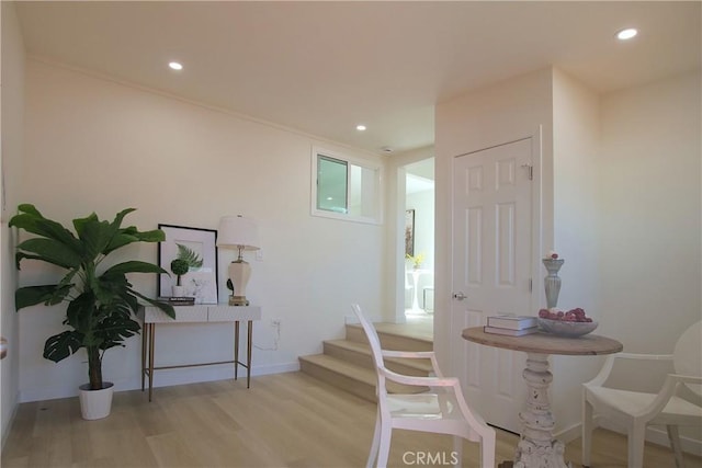 dining area featuring wood finished floors, recessed lighting, baseboards, and stairs