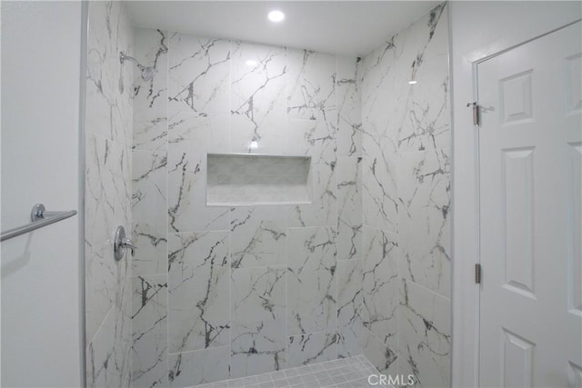 full bath featuring a marble finish shower and recessed lighting