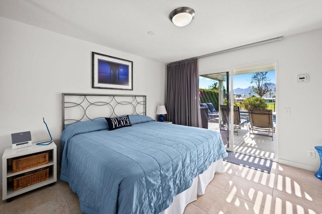 tiled bedroom featuring access to outside