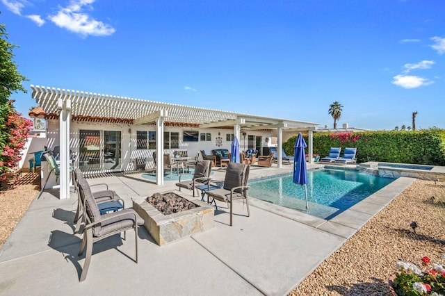 view of pool with a fire pit, a patio area, and a pergola