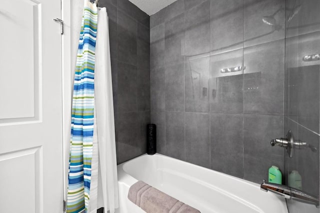 bathroom with shower / bath combination with curtain