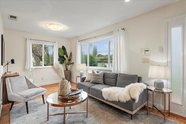 living room featuring parquet flooring