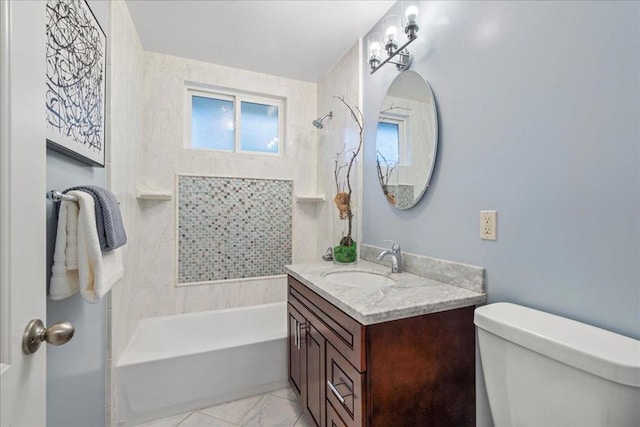 full bathroom with vanity, toilet, and tiled shower / bath combo