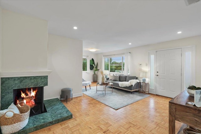 living room with parquet floors and a premium fireplace