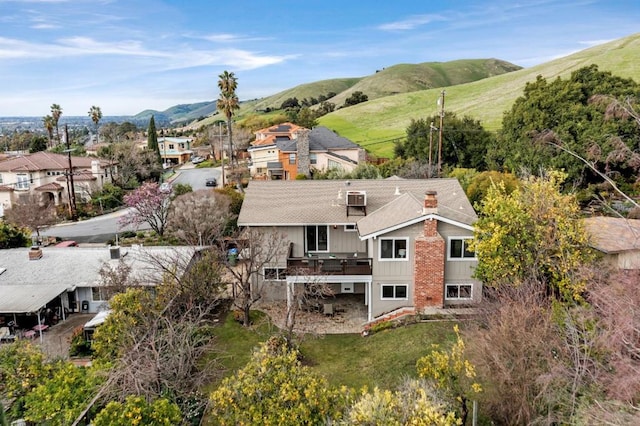 birds eye view of property with a mountain view