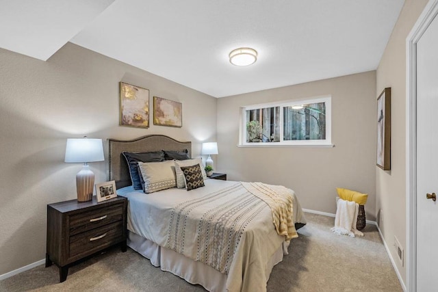 bedroom featuring light colored carpet