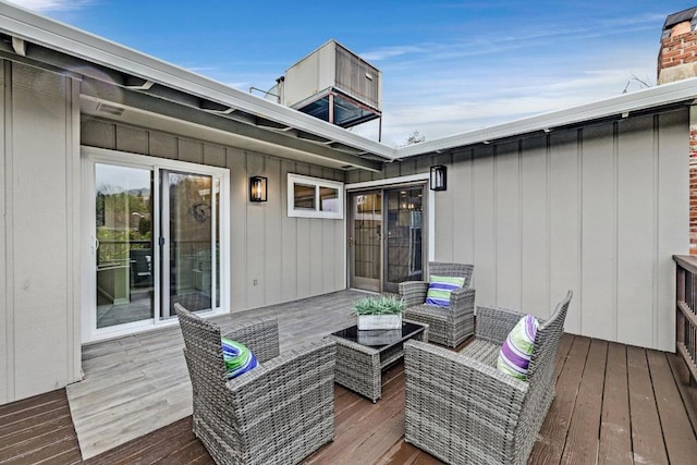 wooden deck featuring outdoor lounge area