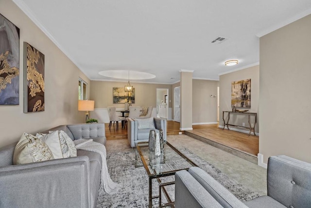 living room with ornamental molding and hardwood / wood-style floors