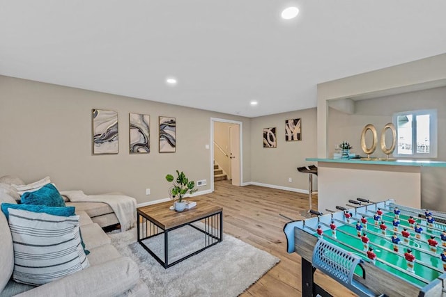 living room with light hardwood / wood-style floors