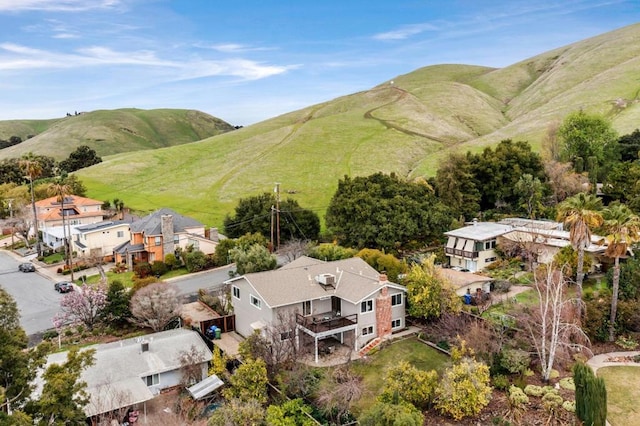 birds eye view of property featuring a mountain view