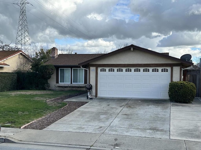 ranch-style home with a garage and a front lawn