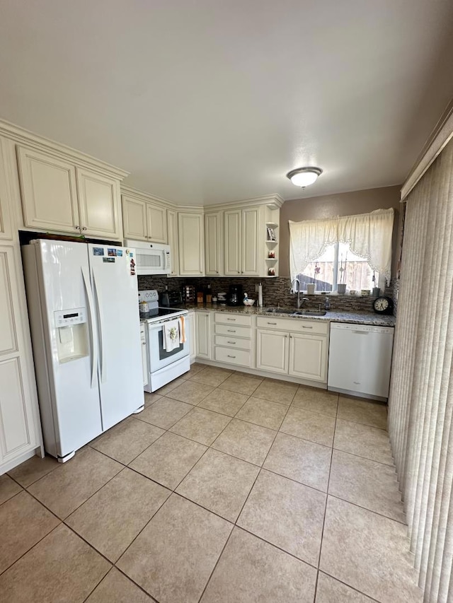 kitchen featuring sink, white appliances, decorative backsplash, and light tile patterned flooring