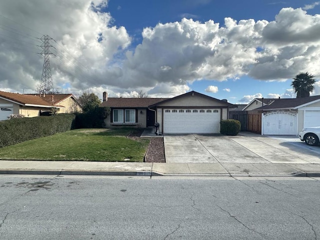 ranch-style home featuring a garage and a front lawn