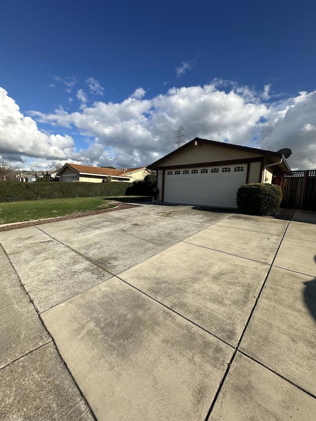 view of property exterior featuring a garage