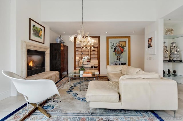 living room featuring a chandelier and a high end fireplace