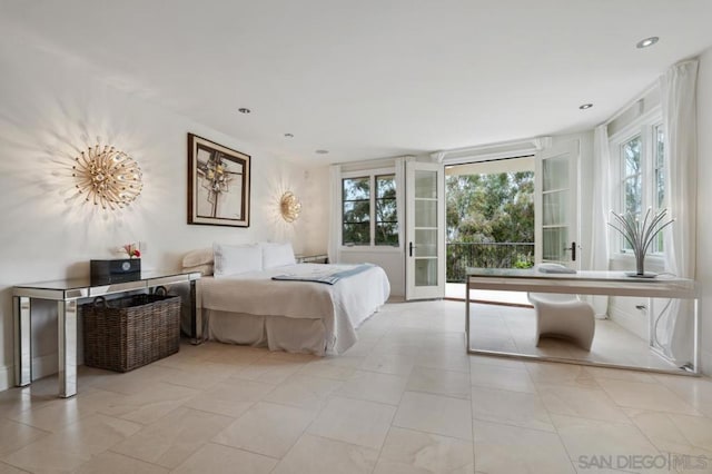 bedroom featuring french doors and access to exterior