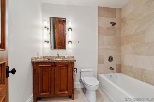 full bathroom featuring vanity, toilet, and tiled shower / bath