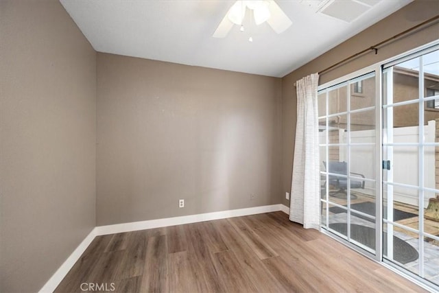 empty room with hardwood / wood-style flooring and ceiling fan