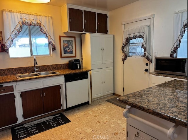 kitchen with dishwasher, dark brown cabinets, and sink