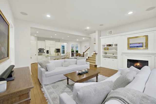 living room with light hardwood / wood-style floors