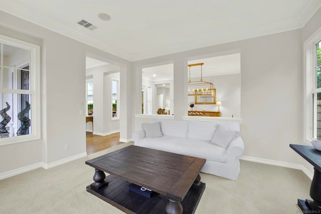 living room featuring light colored carpet and ornamental molding