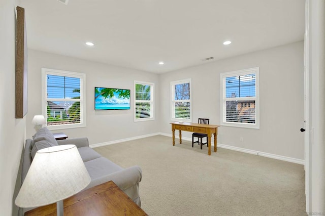 living area with light colored carpet