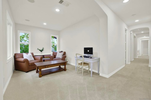 living room featuring light carpet