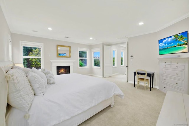 carpeted bedroom featuring multiple windows and ornamental molding