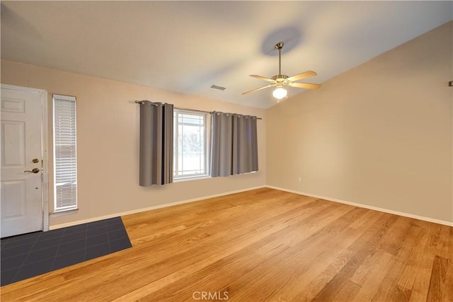 interior space with hardwood / wood-style flooring, ceiling fan, and lofted ceiling