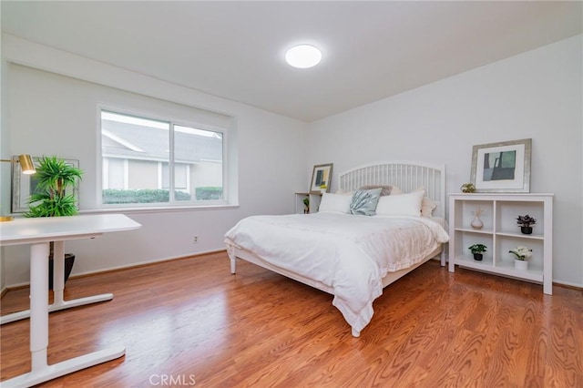 bedroom with wood-type flooring