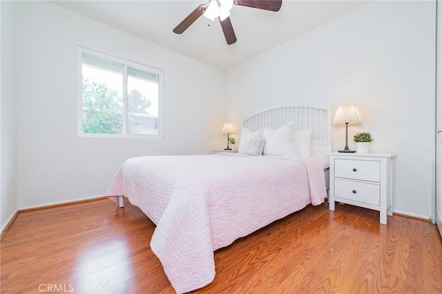 bedroom featuring ceiling fan and hardwood / wood-style floors